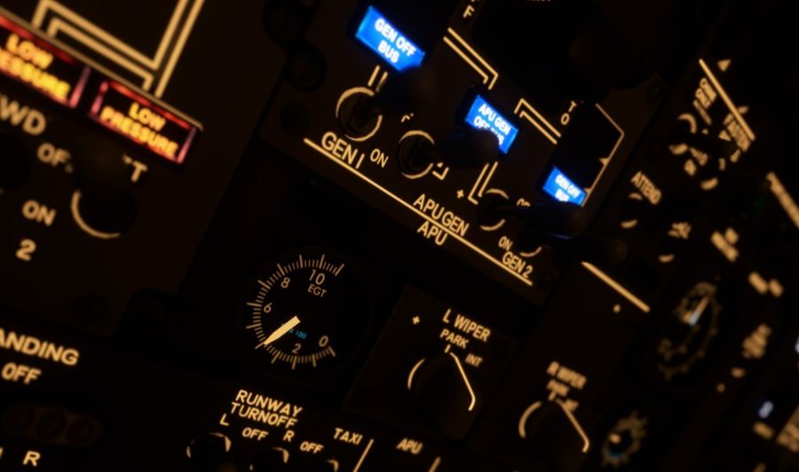 Aircraft cockpit control panel showing APU and engine instrumentation used to monitor performance including exhaust gas temperature